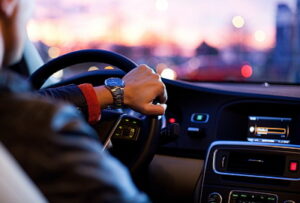 Man driving a car showing dashboard