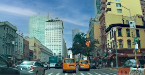 8th Ave. NYC with blue sky and clouds